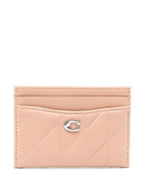 farfetch monederos coach.